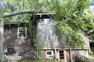 In an instant, a powerful storm overturned boats and docks, and uprooted trees sending limbs crashing down on power lines, and a number of vehicles and houses in the vicinities of Arden, Sharbot Lake and Bolingbroke on Friday afternoon (September 21)